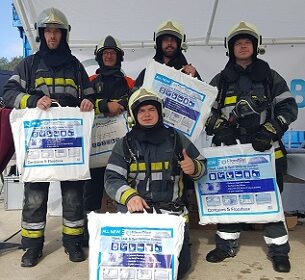 Firefighters with FloodSax alternative sandbags (2) Firefighters with FloodSax alternative sandbags